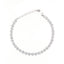 Silver-toned bracelet featuring a continuous line of circular clusters, each adorned with clear faceted stones, a lobster cla