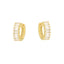 Pair of gold-toned huggie hoop earrings featuring a row of clear baguette-cut stones along the front.