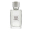 Clear rectangular glass perfume bottle with a light liquid and a silver-toned textured cap, featuring a white and grey label.
