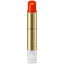 Lipstick with gold casing and red lipstick on a white background.