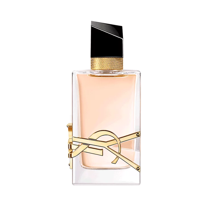 Rectangular clear glass perfume bottle with pale liquid, gold-toned YSL logo, textured gold collar, and an angled black cap.