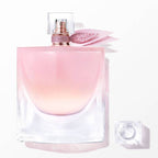 Lancome La Vie Est Belle Eau de Parfum bottle with light pink liquid, rose-gold toned sprayer, and pink glittery petal embell