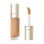 Clarins Skin Illusion All-in-One Concealer in a medium beige shade, in a clear glass bottle with a gold-toned cap and a flock