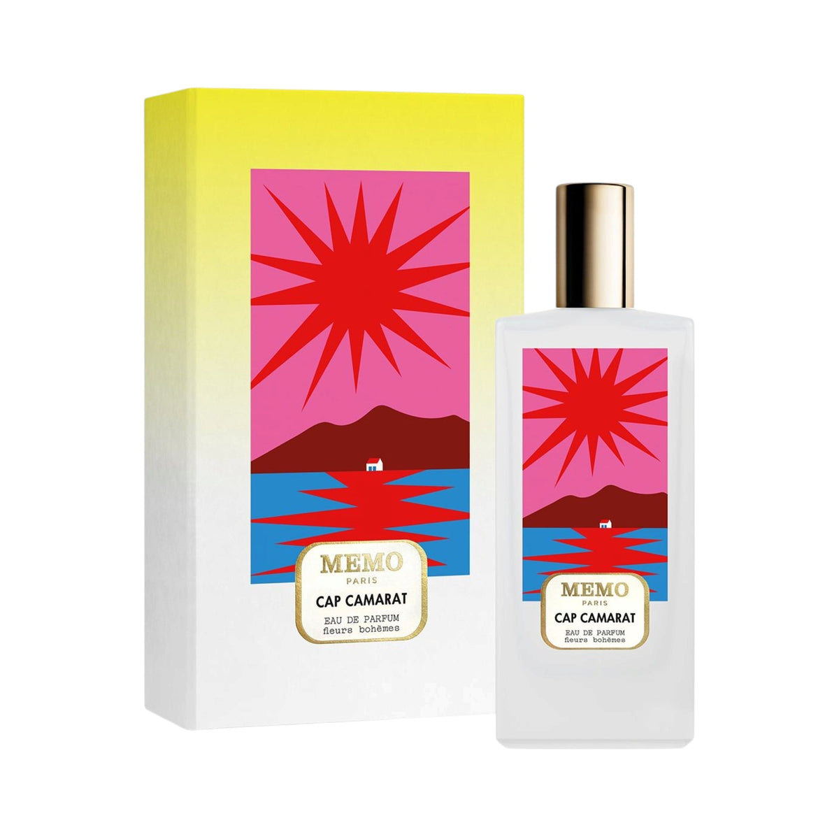 Frosted white perfume bottle with gold-toned cap and a vibrant label featuring a red sun, pink sky, mountains, and blue water
