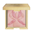 Pink compact powder with an embossed floral design in a gold-toned square case.
