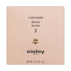 Light peach-pink square compact with gold-toned orchid design and 'L'ORCHIDÉE Glow blush 3 Sisley PARIS' text.