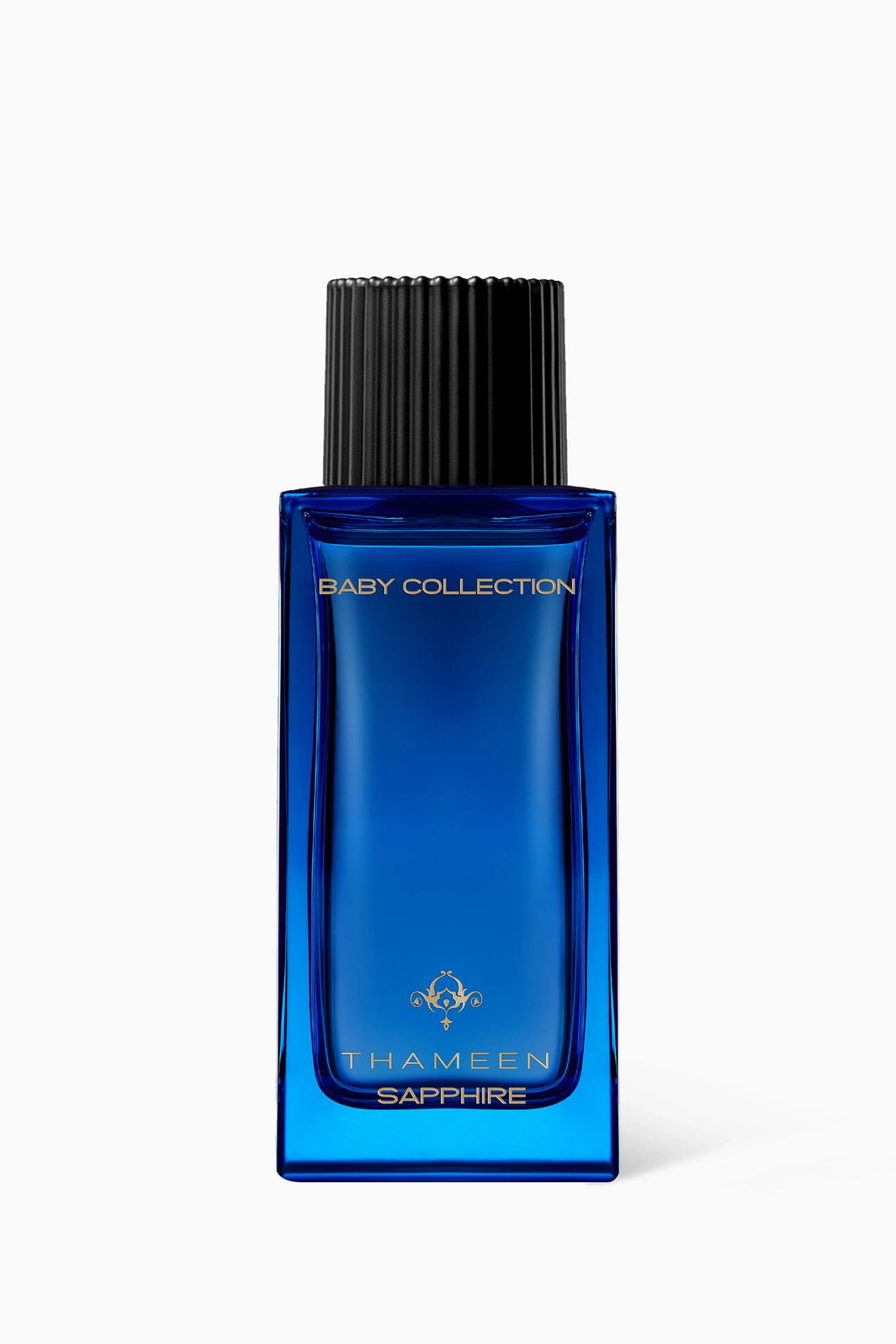 Thameen Sapphire Baby Fragrance in a rectangular blue glass bottle with a black ribbed cap and gold-toned lettering.