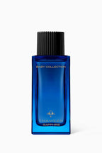 Thameen Sapphire Baby Fragrance in a rectangular blue glass bottle with a black ribbed cap and gold-toned lettering.
