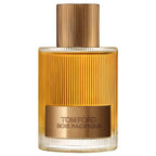 Tom Ford Signature Bois Pacifique EDP Spray in a clear and amber-toned ribbed glass bottle with a gold-toned metallic cap.