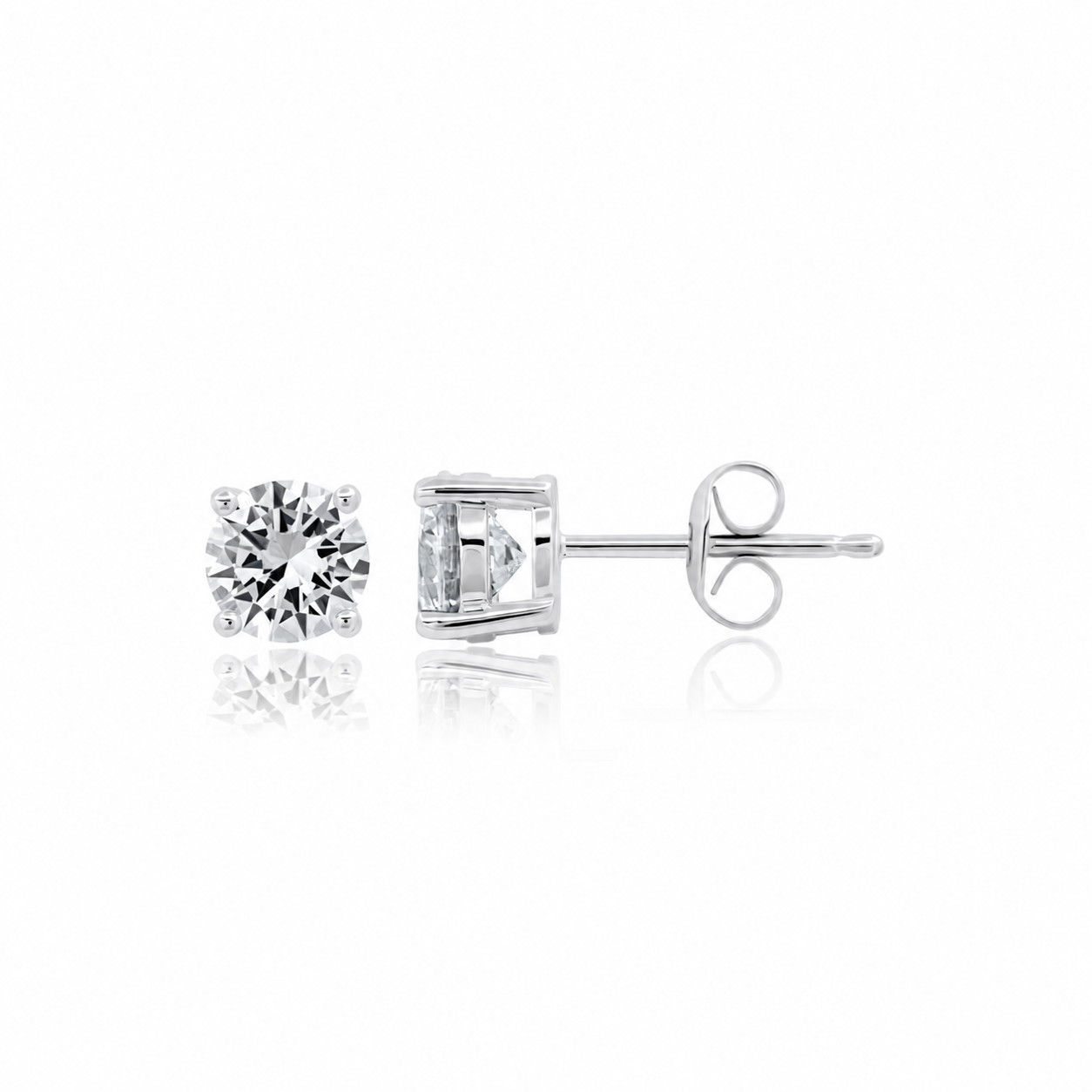 Pair of silver-toned stud earrings, each with a round, brilliant-cut clear stone in a four-prong setting and butterfly backin