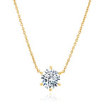 Yellow gold-toned cable chain necklace with a clear round faceted stone in a six-prong setting.