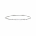 Silver-toned flexible tennis bracelet with a single row of clear, round stones and a flat bar clasp.