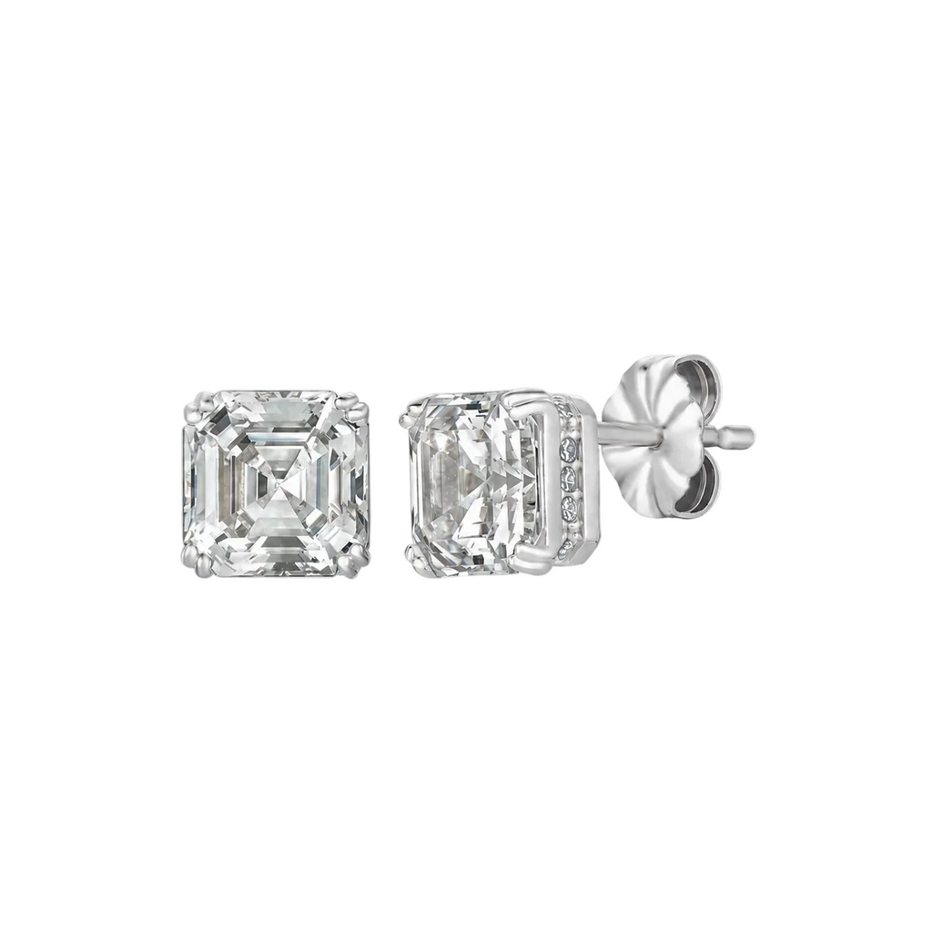 Pair of silver-toned stud earrings, each with a large clear square-cut stone. One setting features pave-set clear stones on i