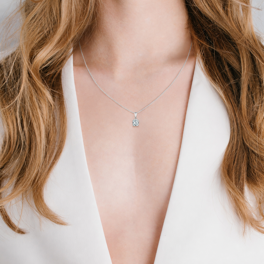 Silver-toned chain necklace with an Asscher-cut clear stone pendant in a four-prong setting.