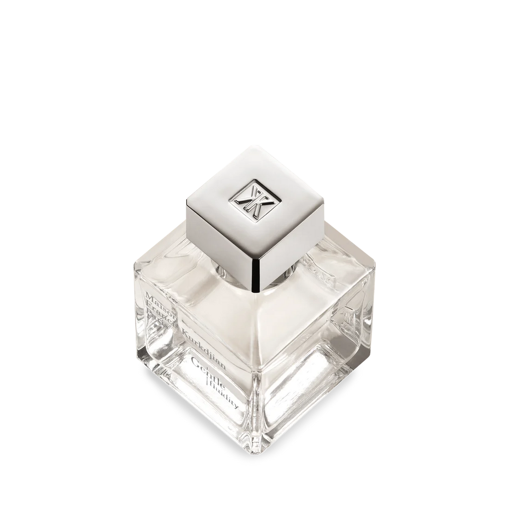 Clear square glass perfume bottle with a silver-toned square cap featuring an embossed MK logo. Contains clear liquid.