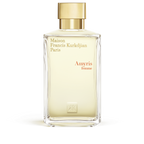 Clear rectangular glass perfume bottle with light yellow liquid and a gold-toned cap. Features 'Maison Francis Kurkdjian' tex