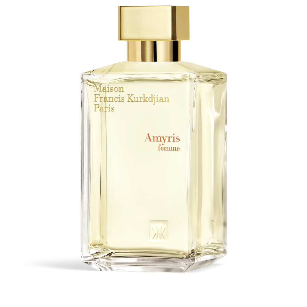 Clear faceted glass perfume bottle with pale yellow liquid, a gold-toned rectangular cap, and gold-toned and reddish-orange t