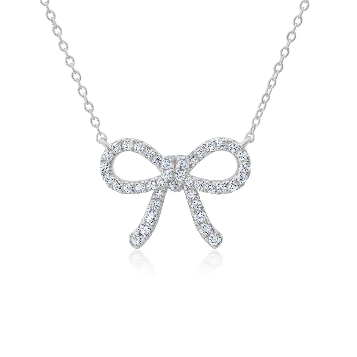Silver-toned necklace with a bow-shaped pendant fully encrusted with clear, sparkling cubic zirconia stones.