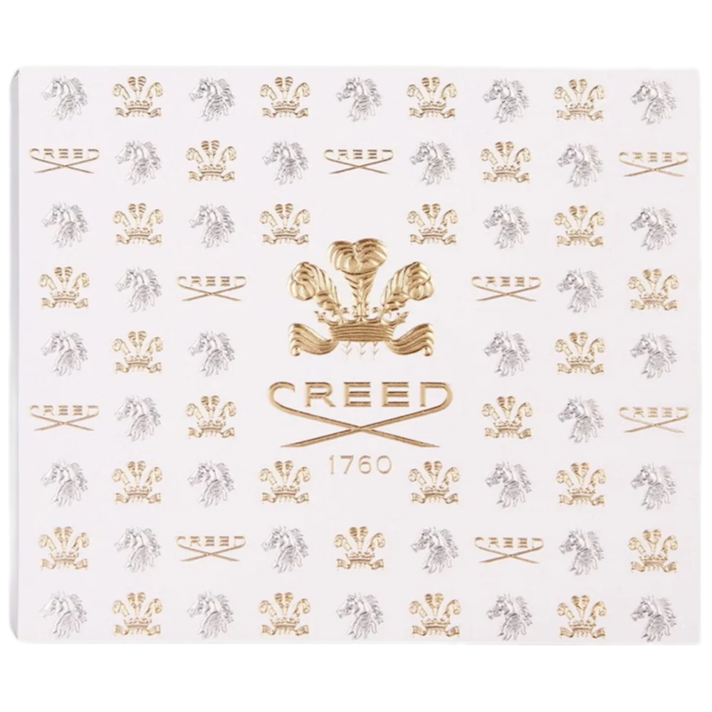 White rectangular box with repeating gold-toned and silver-toned Creed emblems. Gold-toned plumed crest above 'CREED 1760'.