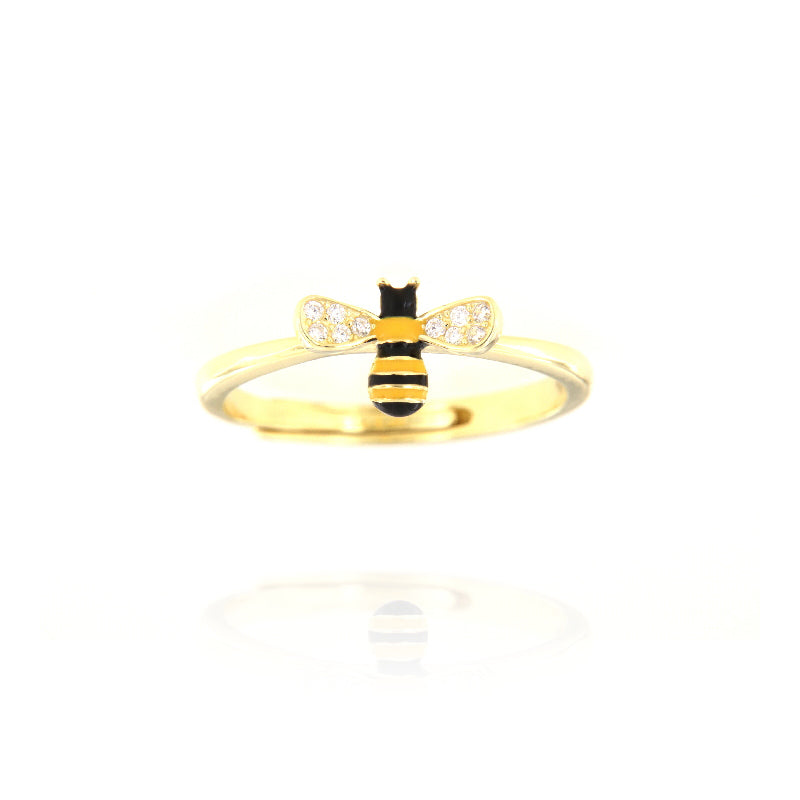 Gold-toned adjustable ring featuring a bee motif with black and yellow enamel stripes and clear sparkling stones on its wings