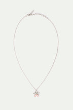 Silver-toned necklace with a flower pendant featuring five petals and two light pink teardrop stones.