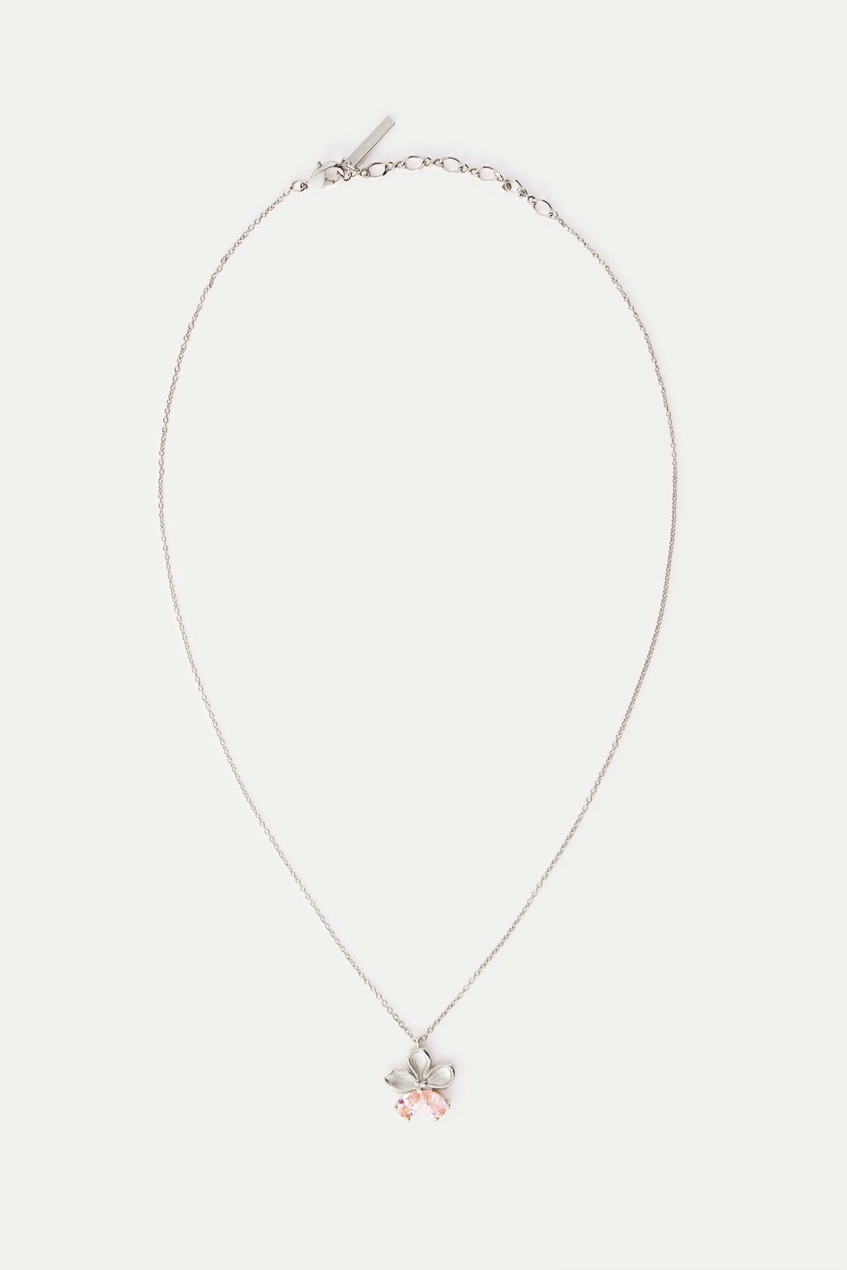 Silver-toned necklace with a flower pendant featuring five petals and two light pink teardrop stones.