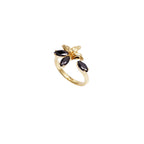 Gold-toned adjustable ring with a textured floral design and four black marquise-cut stones.