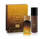 Azal Monsieur luxury fragrance gift set displaying a 100ml brown body perfume bottle (Step 1), a 100ml gradient amber glass Eau de Parfum bottle with a wooden cap (Step 2), and their matching gold and brown floral-patterned presentation box.