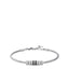 Silver-toned steel snake chain bracelet with three black enamel cylindrical beads and two silver-toned ribbed beads.