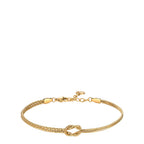 Gold-toned bracelet with a central knot. One side features two textured chains, the other two smooth snake chains. Lobster cl