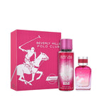 A hot pink gift set including a box, a tall perfume mist, and a shorter perfume bottle. All items feature a white polo player