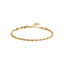 Gold-toned steel rope chain bracelet with a lobster clasp and extender chain, featuring a small round charm.