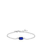 Silver-toned chain bracelet with a rectangular deep blue stone centered between two clusters of small white zircons. Extender