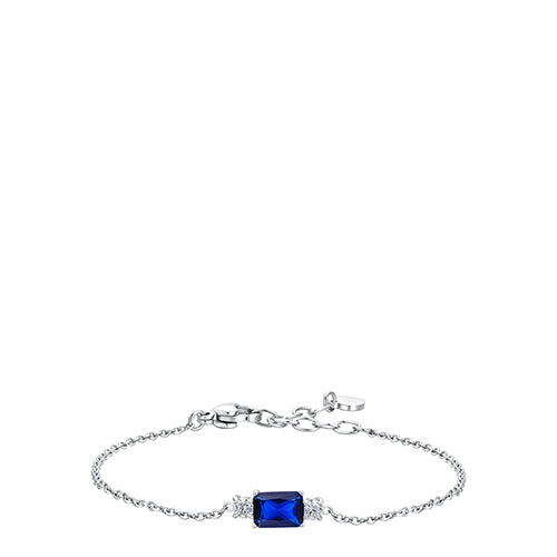 Silver-toned chain bracelet with a rectangular deep blue stone centered between two clusters of small white zircons. Extender