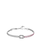 Silver-toned steel bracelet with a central knot, one side adorned with clear zircons and the other with pink zircons.