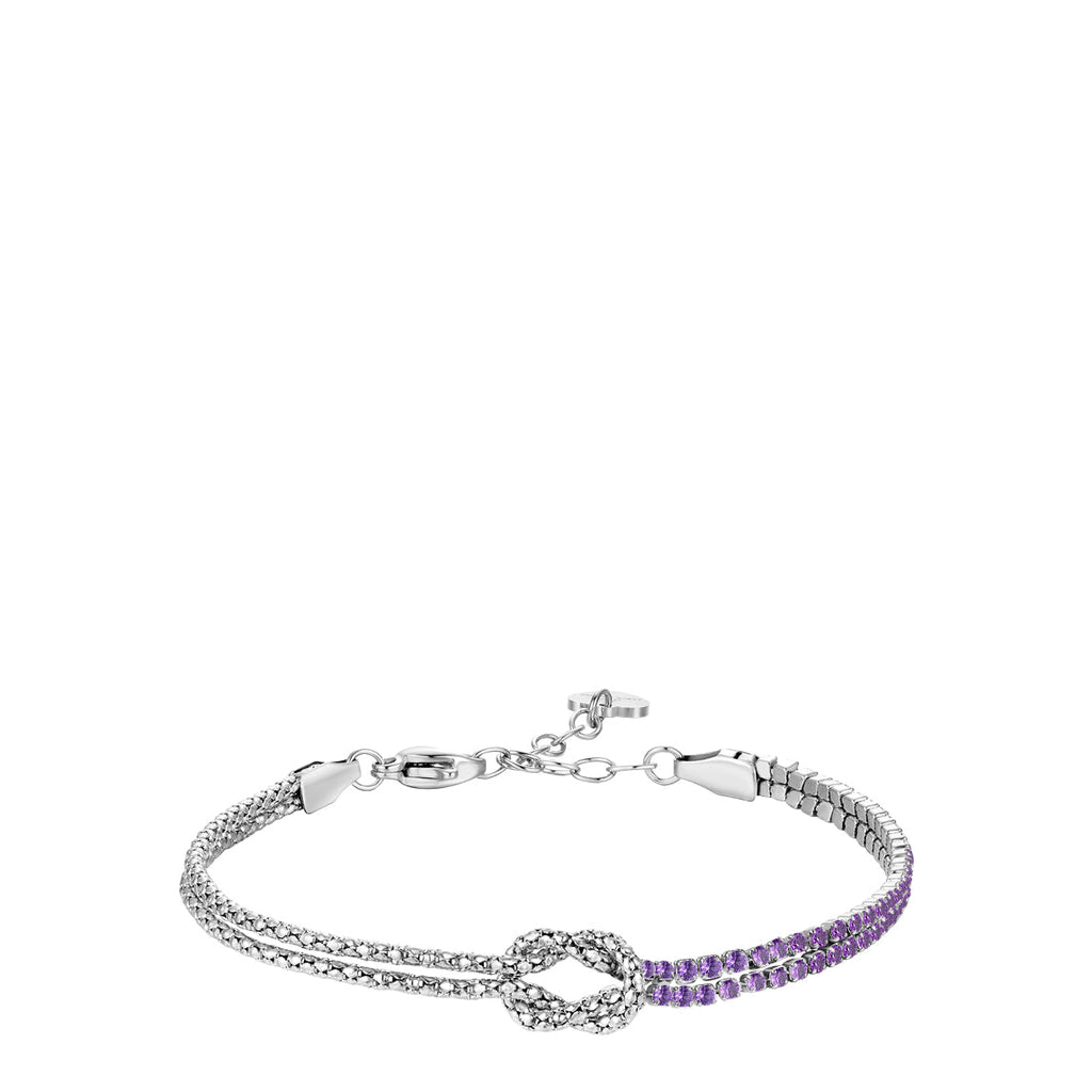 Silver-toned steel bracelet with a central knot. One side features two rows of clear zircons, the other has two rows of purpl