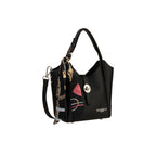 Black pebbled leather bucket bag with a single handle, detachable strap, silver-toned turn-lock, and a black scarf with gold-