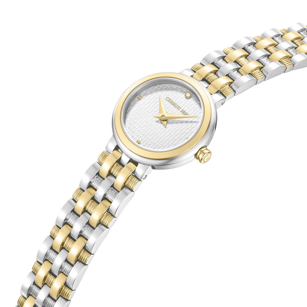 Detailed macro studio shot of the Lusia watch dial, highlighting the shimmering clear crystal pavé bezel, yellow gold indices, and white face texture.