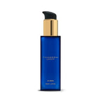 Thameen Rivière body lotion in a deep blue rectangular glass bottle with a gold-toned pump and black dispenser.