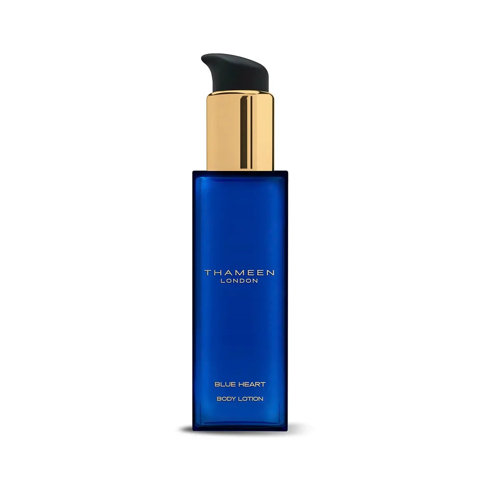 Royal blue rectangular body lotion bottle with a gold-toned pump dispenser and black nozzle, featuring 'THAMEEN LONDON' brand