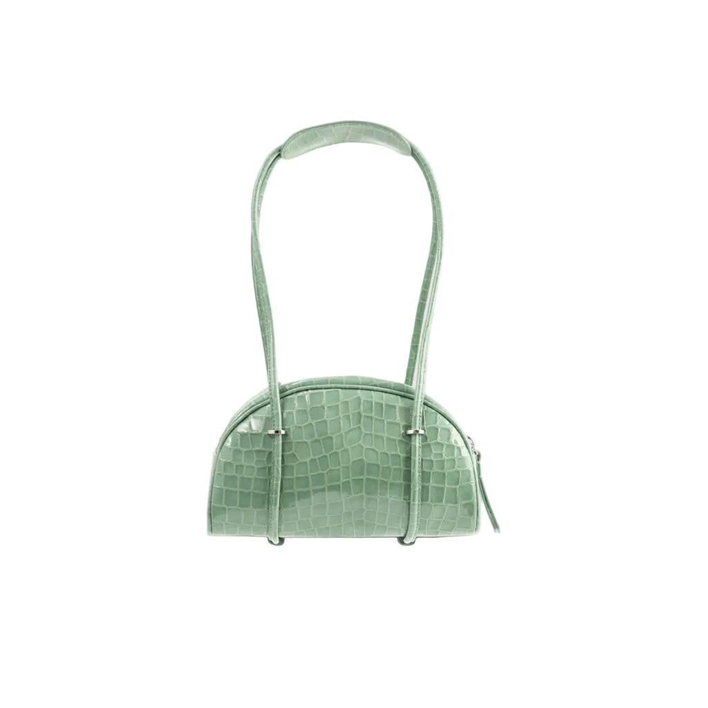 Front view of the BY FAR Kimberly Bowler shoulder bag in fresh green croco-embossed leather featuring a semi-circular body, two long tubular straps, and silver hardware accents.