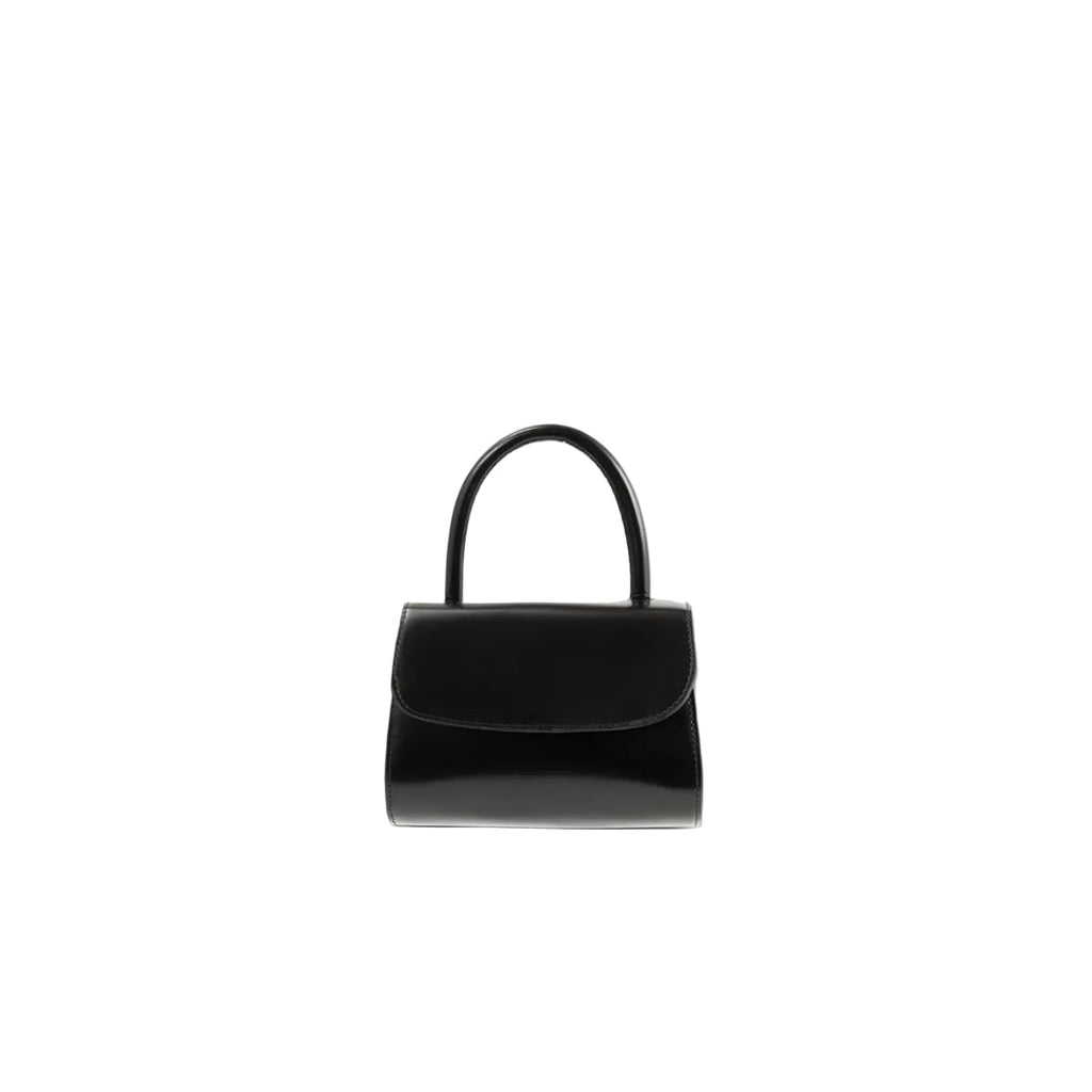 Front view of the BY FAR Mini 2.0 top handle bag in black semi-patent leather featuring a small structured body and a single curved handle against a light grey background.