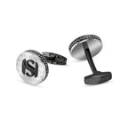 Round silver-toned and black cufflinks. Front: black interlocking SH logo on S-patterned face, black S-patterned edge. Black