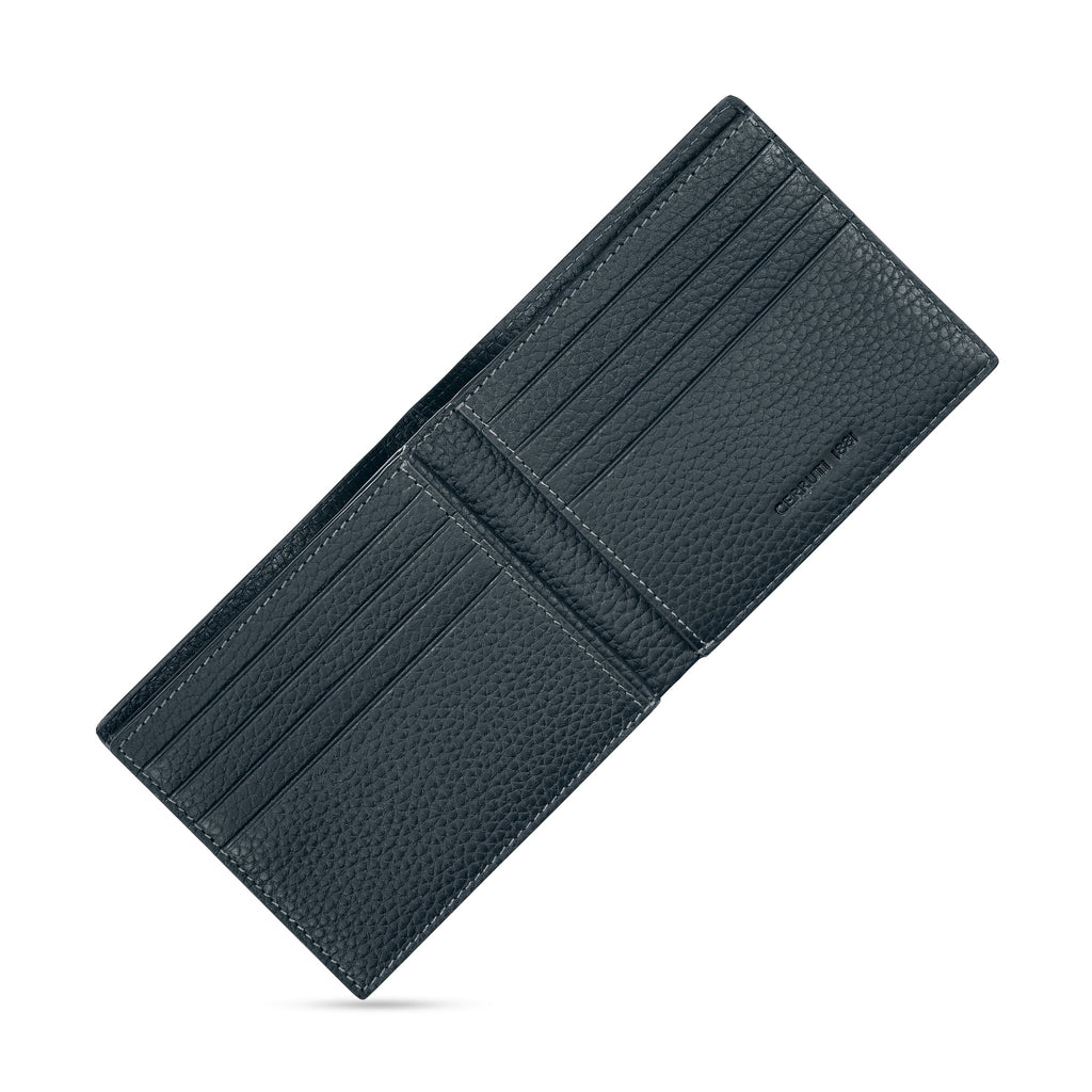 Dark blue pebbled full-grain leather bifold wallet, open, with multiple card slots, white stitching, and 'CERRUTI 1881' brand