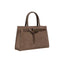 Taupe structured handbag with two top handles and a decorative front strap with a rectangular gold-toned buckle.