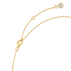 Gold-toned chain necklace with a lobster clasp, an extender chain, and a small round clear stone in a bezel setting at the en