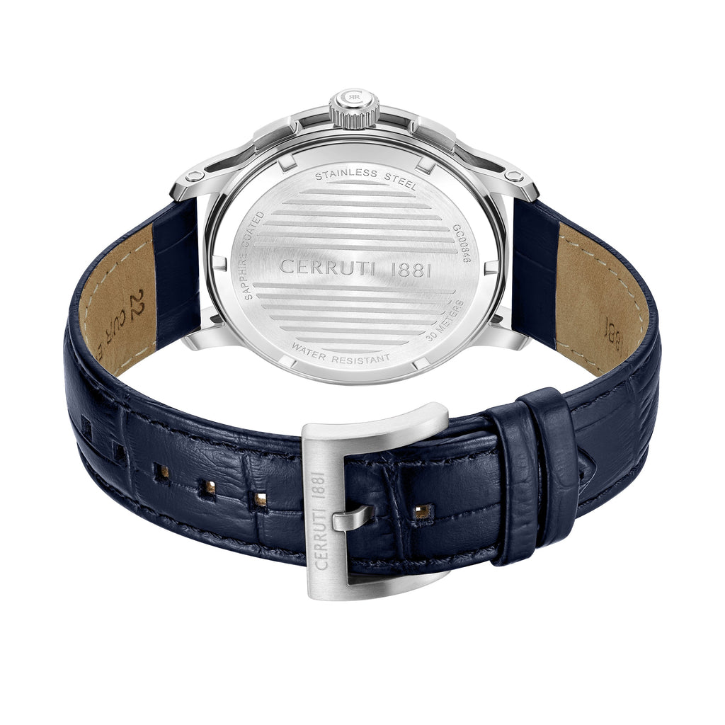 Back view of a silver-toned stainless steel watch with a dark blue crocodile-textured leather strap and silver-toned buckle.