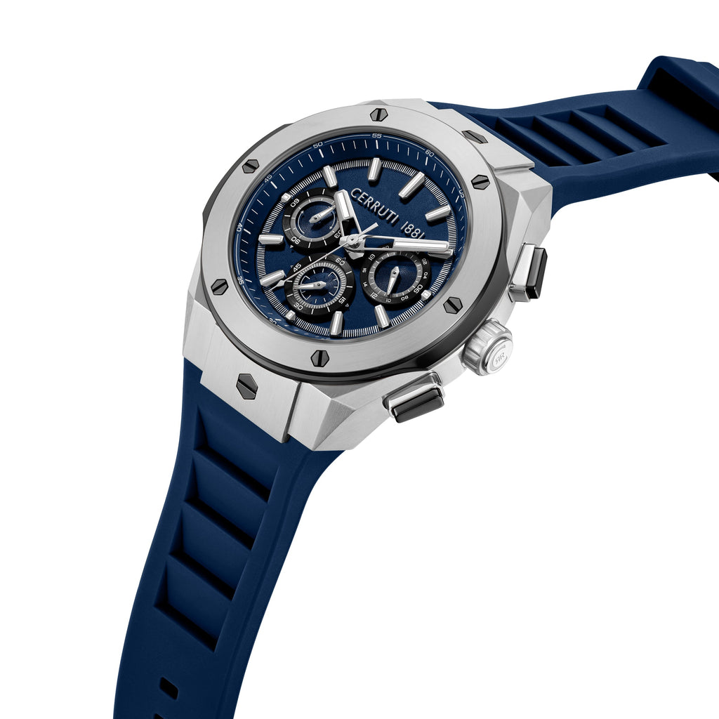 Silver-finished chronograph watch with an octagonal case, blue dial, three subdials, and a blue ribbed silicone strap.