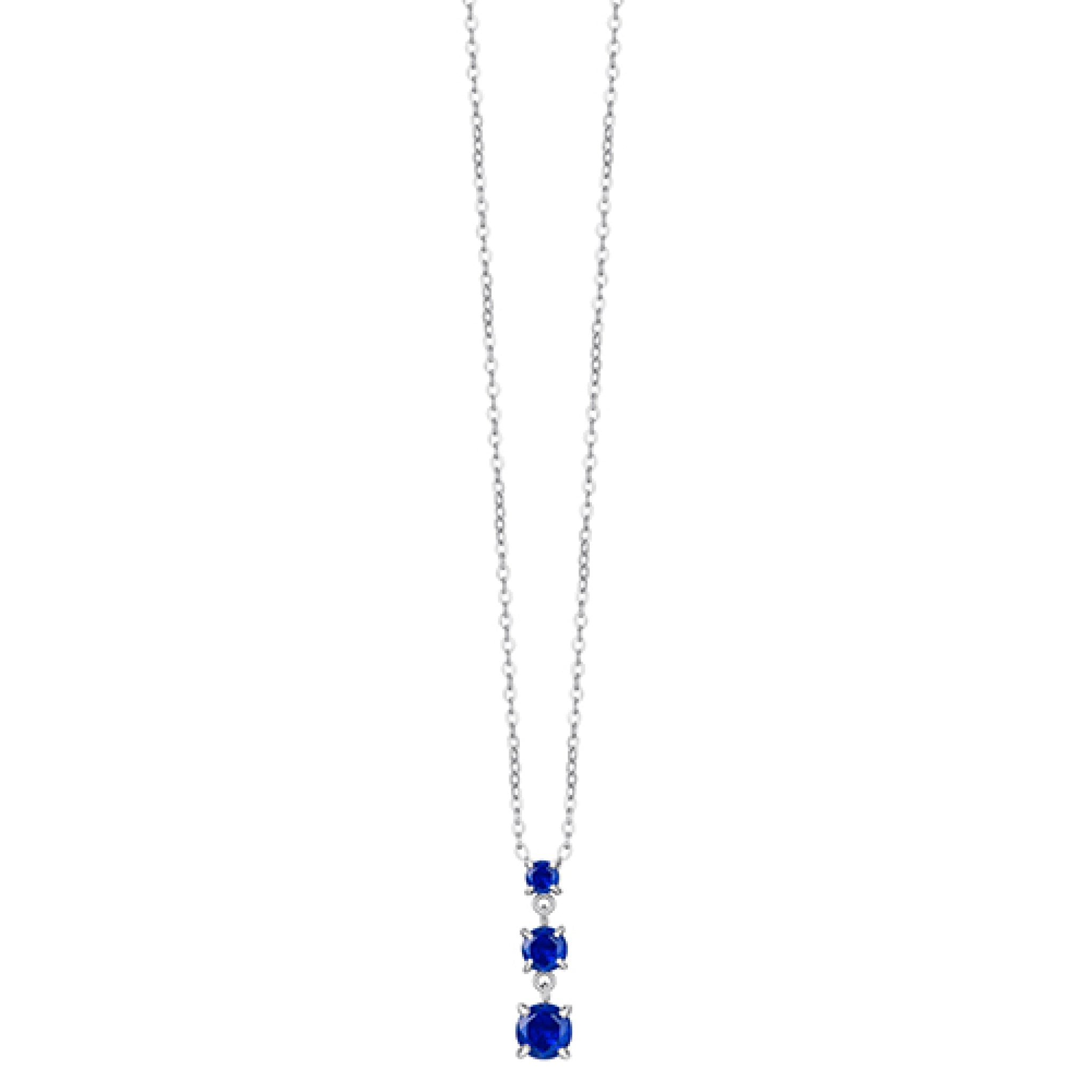 Silver-toned steel necklace with three graduated round-cut blue zircons in a drop pendant.