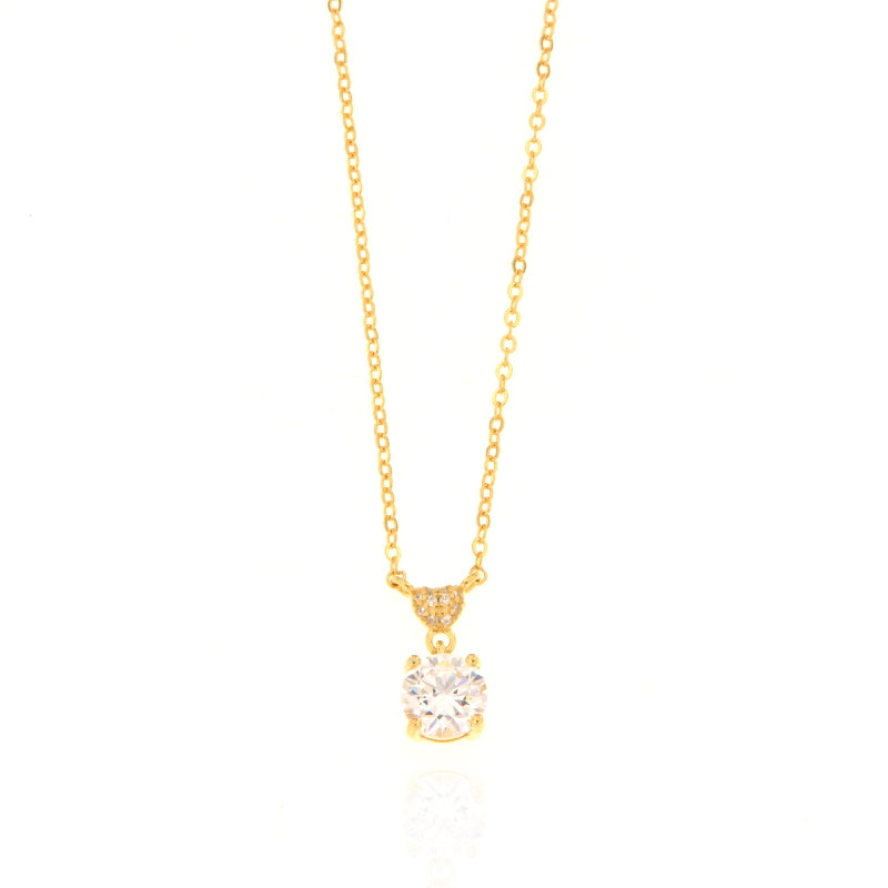 Gold-toned delicate chain necklace with a round, brilliant-cut clear stone pendant and a small embellished bail.